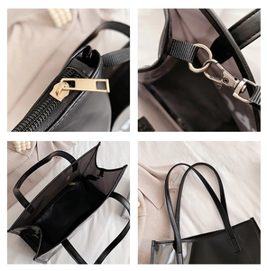 Detailed view of black transparent tote bag with golden zipper and interior pocket