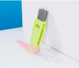 3-in-1 green multifunctional brush with grey head and pink folding gap cleaning tool