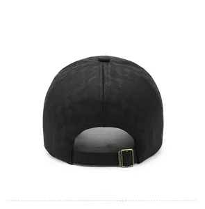 Detail view of adjustable back strap and bronze metal buckle on black checkered baseball cap