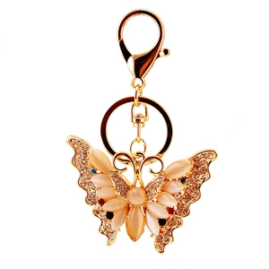 Golden butterfly keychain with sparkling rhinestones and opal stone for handbags