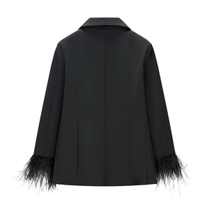 Detail view of black suit jacket back with elegant feather trim on the sleeves