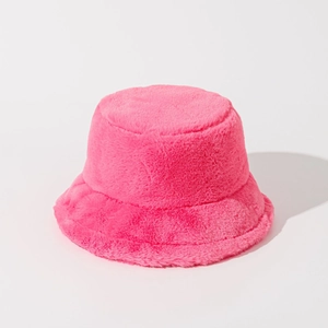 Close-up of soft rose pink faux fur texture on a warm winter bucket hat for women