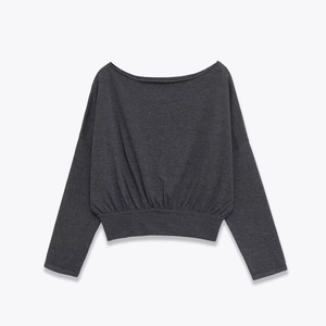 Women's charcoal grey long sleeve knit sweater with wide boat neck and ribbed waist hem