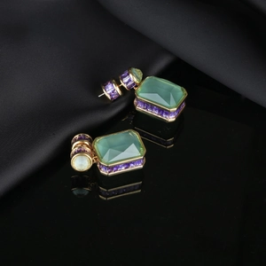 Elegant vintage gold drop earrings with large green gemstones and purple zircon accents