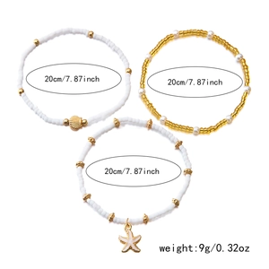 Detailed view of bohemian starfish and shell beaded anklets with 20cm size measurement