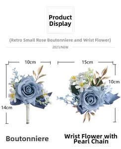 Detail view of dusty blue artificial rose boutonniere and wrist corsage with pearl beads