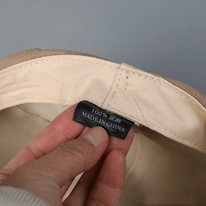 Detail of 100% linen fabric texture and inner lining on a Japanese style sun hat