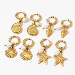 Golden stainless steel ocean theme hoop earrings set with pearls and seashell charms