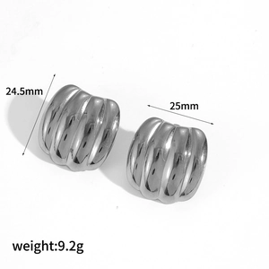 Detail view showing dimensions and ridged texture of silver C-shaped steel earrings