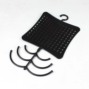 Multi-tier black jewelry organizer rack featuring tree-style hooks and textured surface