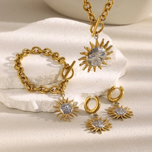 Detail of sun face jewelry set in gold and silver finish with OT toggle clasps