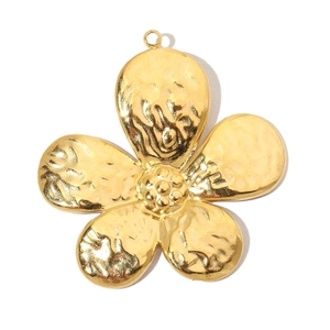 Macro shot of gold floral titanium steel pendant featuring hammered texture and hanging ring