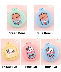 Detailed close-up of foldable cartoon hairbrushes with built-in mirrors in multiple colors