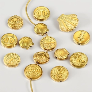 Golden stainless steel large hole beads with shell, tiger, and fishbone charms for DIY jewelry