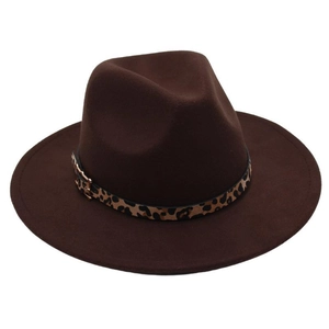 Detailed view of dark brown fedora hat with leopard print band and gold metal buckle