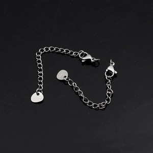 Detailed view of silver stainless steel extension chain with lobster clasps and S.Steel tag