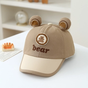 Detailed close-up of cute 3D bear ears and bear embroidery on toddler baseball cap