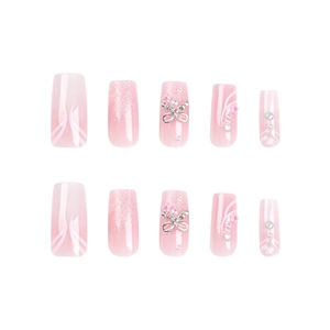 Pink gradient press-on nails with silver bows, pearls and glitter accents, 10-piece set