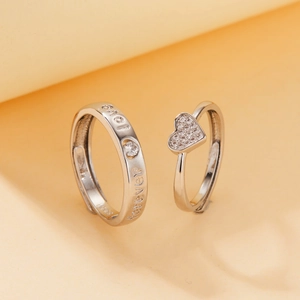 Detailed macro view of S925 silver rings set with heart shape and Love Forever engraving