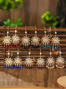 Detailed set of bohemian drop earrings with hollow flowers and colorful beads