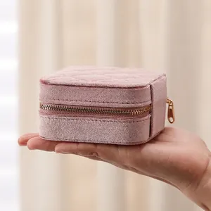 Pink velvet quilted jewelry box with gold zipper for rings and earrings storage