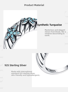 Detail of vintage S925 sterling silver ring with engraved hallmark and turquoise inlay