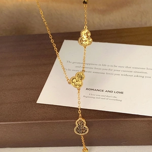 18k gold plated necklace with triple filigree gourd pendants on an elegant O-chain