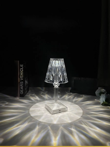 Macro shot of diamond-cut crystal desk lamp with USB charging port and touch control