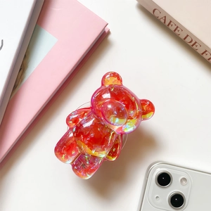 Detail of red 3D bear phone grip with holographic sequins and glossy resin finish