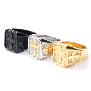Cross signet rings in black, gold, and silver finishes with matte stone texture details