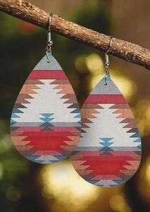 Detail of teardrop leather earrings with red and blue geometric Southwestern patterns