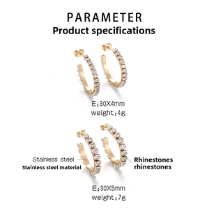Detailed view of gold stainless steel hoop earrings with white zircon rhinestone inlay