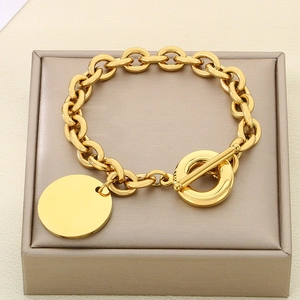 Polished gold 9mm O-chain bracelet with round pendant and toggle clasp for women