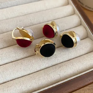 Retro gold earrings with velvet discs and pearls in red and black colors