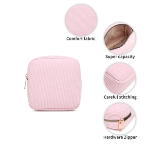 Pink corduroy makeup pouch with gold zipper and multi-view detail features