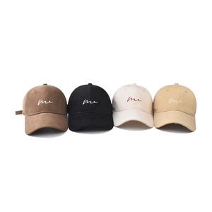 Cotton baseball caps with embroidered me text in brown, black, beige, and yellow colors
