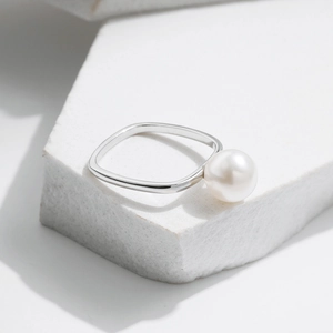 Minimalist S925 sterling silver ring featuring a round white pearl on a stone base
