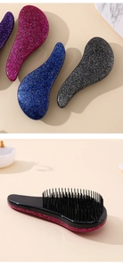 Detail view of colorful glitter hairbrushes with anti-static bristles for smooth hair care