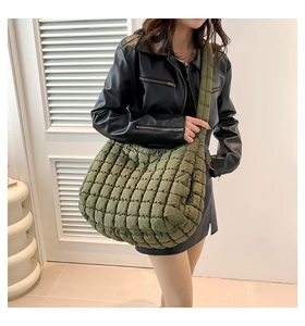 Detail of olive green quilted cloud tote bag showing large capacity and puffy texture