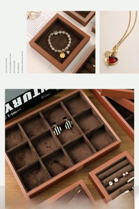 Detail of high-quality brown leather jewelry display tray with velvet flocking interior