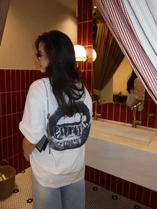 Loose fit white t-shirt for women with bold black lip art print on the back for summer wear