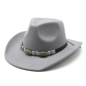 Detail of grey felt cowboy hat featuring turquoise stone and bronze bead band decoration