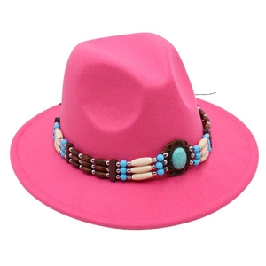 Detailed view of pink felt fedora hat featuring ethnic turquoise beaded band trim