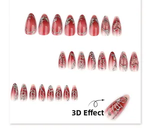 Detail showing red gradient almond press-on nails with 3D silver metallic liquid lines