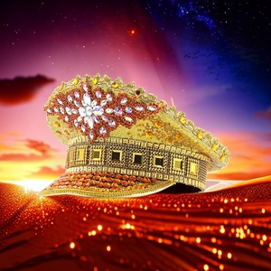 Close-up of golden sequin captain hat with red rhinestone star on surreal desert background