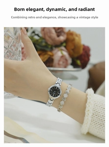 Close-up of elegant silver quartz watch and diamond-set bracelet set on a woman's wrist