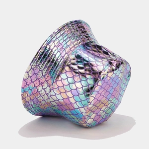 Detailed macro shot of holographic iridescent fish scale texture on a trendy bucket hat