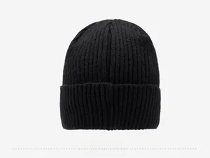 Detail view of the black ribbed knit beanie showing high-quality yarn texture and thick cuff