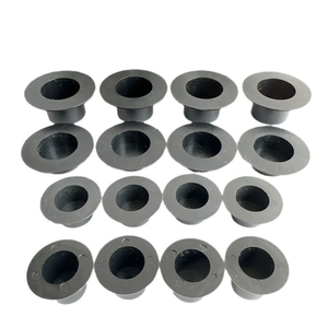 Top view of 16 mini black plastic snowman hats arranged in a neat 4x4 matrix grid