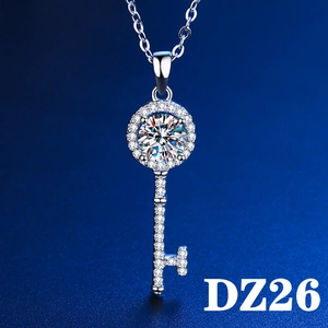 Macro detail of silver key pendant necklace with sparkling 2ct round brilliant zircon